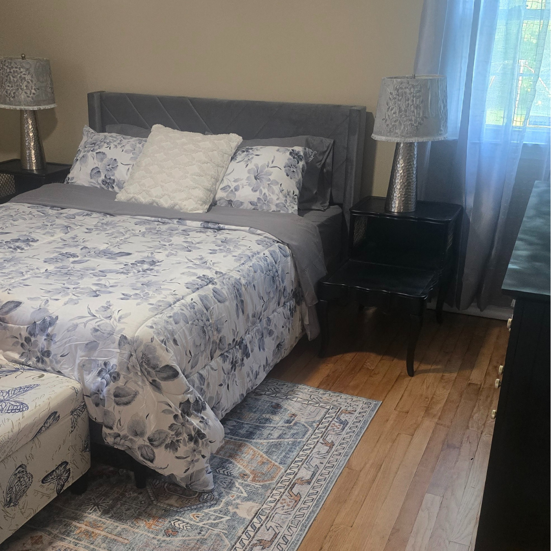 Primary queen bedroom with designer bedding